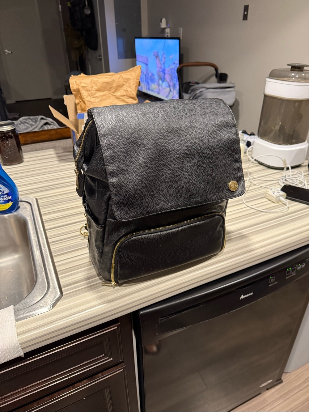 Black Leatherette Men’s Backpack with Gold Accents